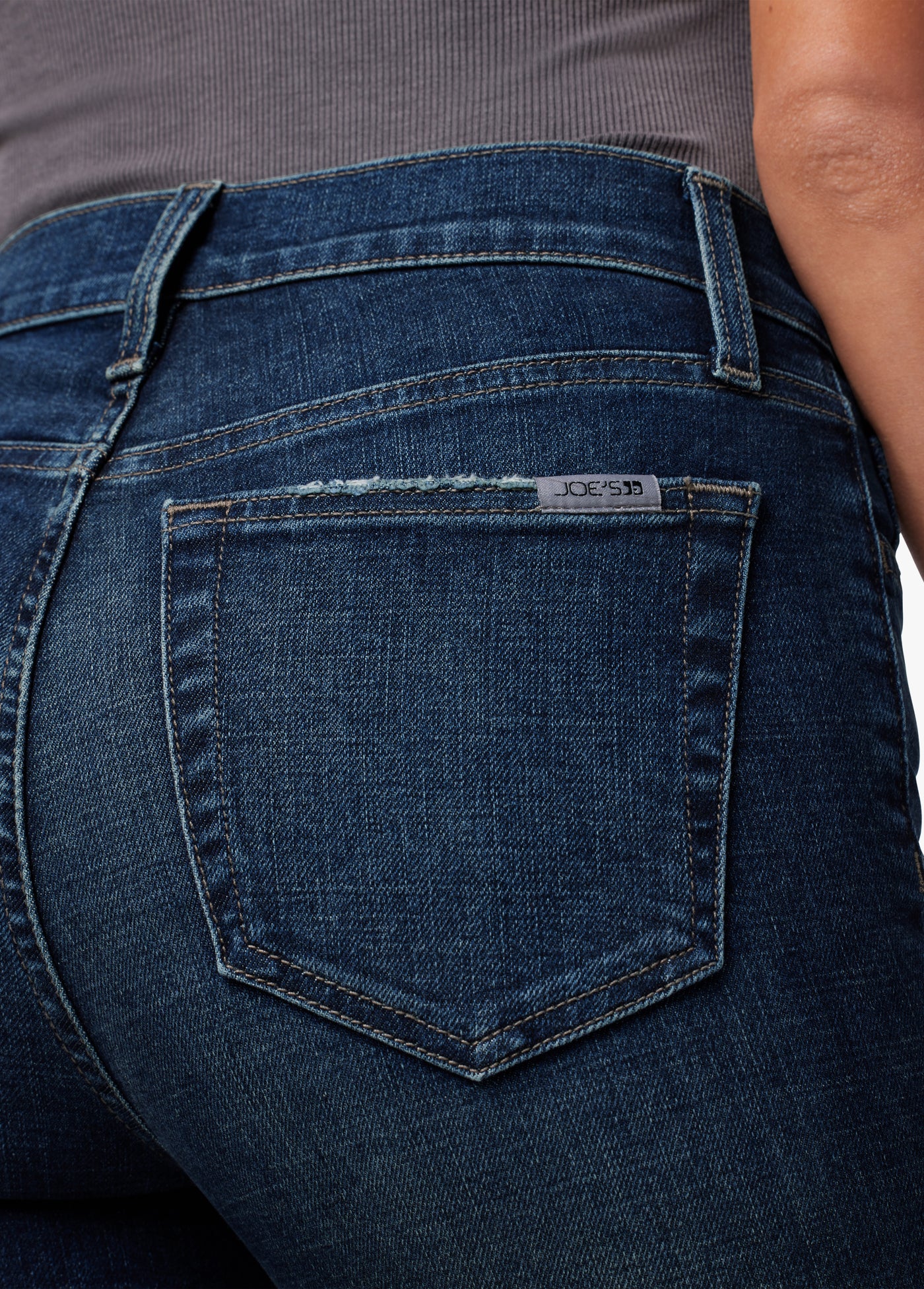 HIGH RISE SKINNY ANKLE W/ H. GRIND HEM